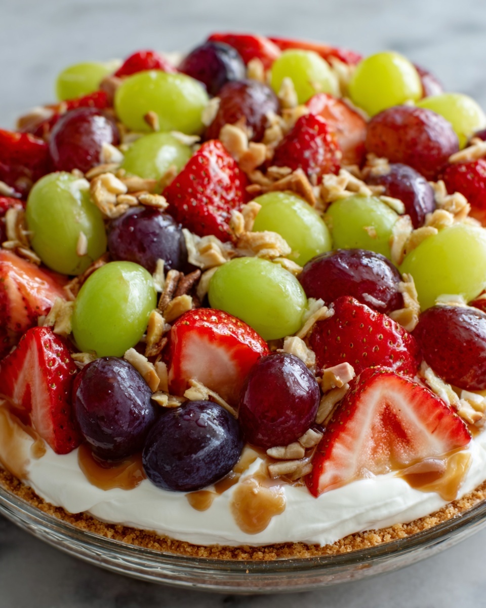 A white bowl filled with a creamy white yogurt base, topped with evenly spread layers of fresh fruit. Bright red strawberry halves are arranged around the edges, while green and purple grapes are scattered over the center. Small chunks of crunchy nuts add texture and small bits of brown granola sprinkle the top, giving a mix of smooth, juicy, and crunchy textures. The dish sits on a white marbled surface. Photo taken with an iphone --ar 4:5 --v 7