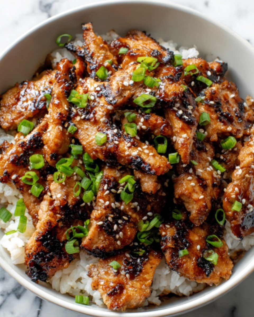 A white bowl filled with a bottom layer of plain white rice, topped with a generous layer of grilled chicken pieces that have a brown, slightly charred glaze. The chicken is garnished with small chopped green onions and a sprinkling of white sesame seeds, adding texture and color contrast. The bowl is set on a white marbled surface. Photo taken with an iphone --ar 4:5 --v 7